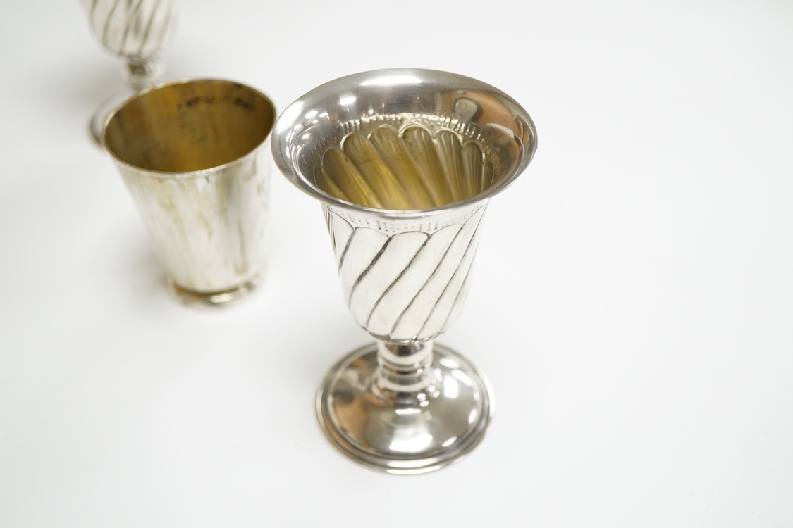 A pair of Turkish? 900 standard white metal goblets, 11.1cm, together with an 800 standard small beaker, 7oz.